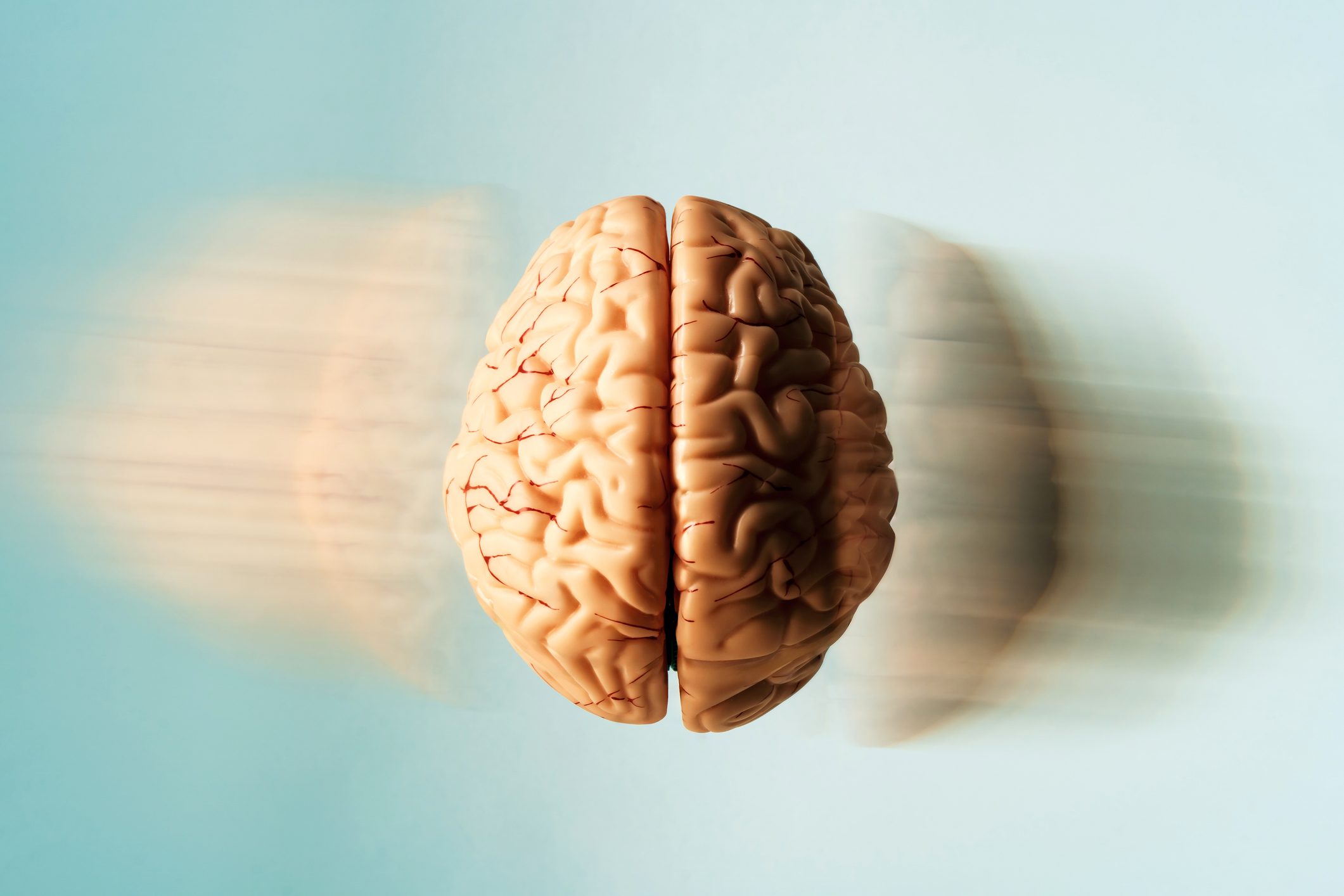 Floating human brain with motion blur to suggest rapid thought