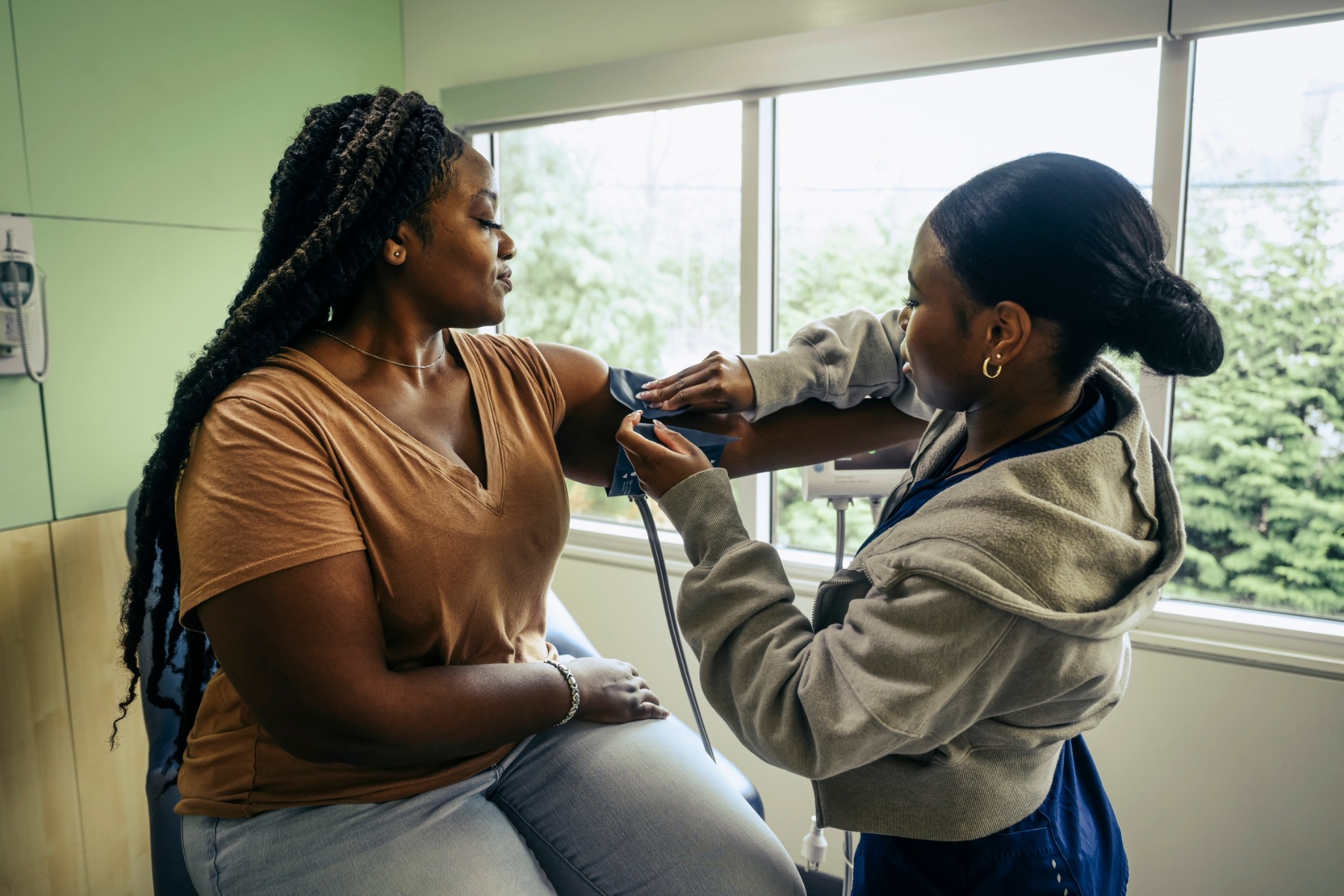 Woman having her blood pressure taken