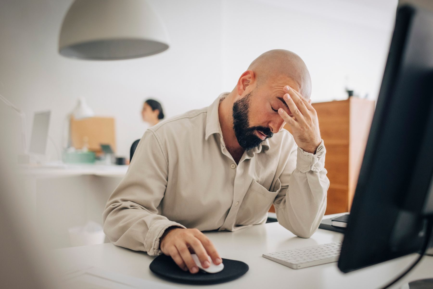 A stressed man at work