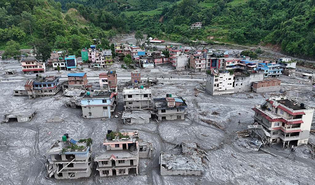 An Aerial view shows debris and mud covering settlements following recent flash floods in DevGhat village, Nepal