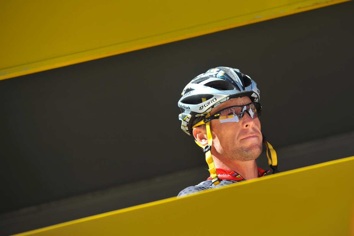 A medium shot of Lance Armstrong wearing his helmet