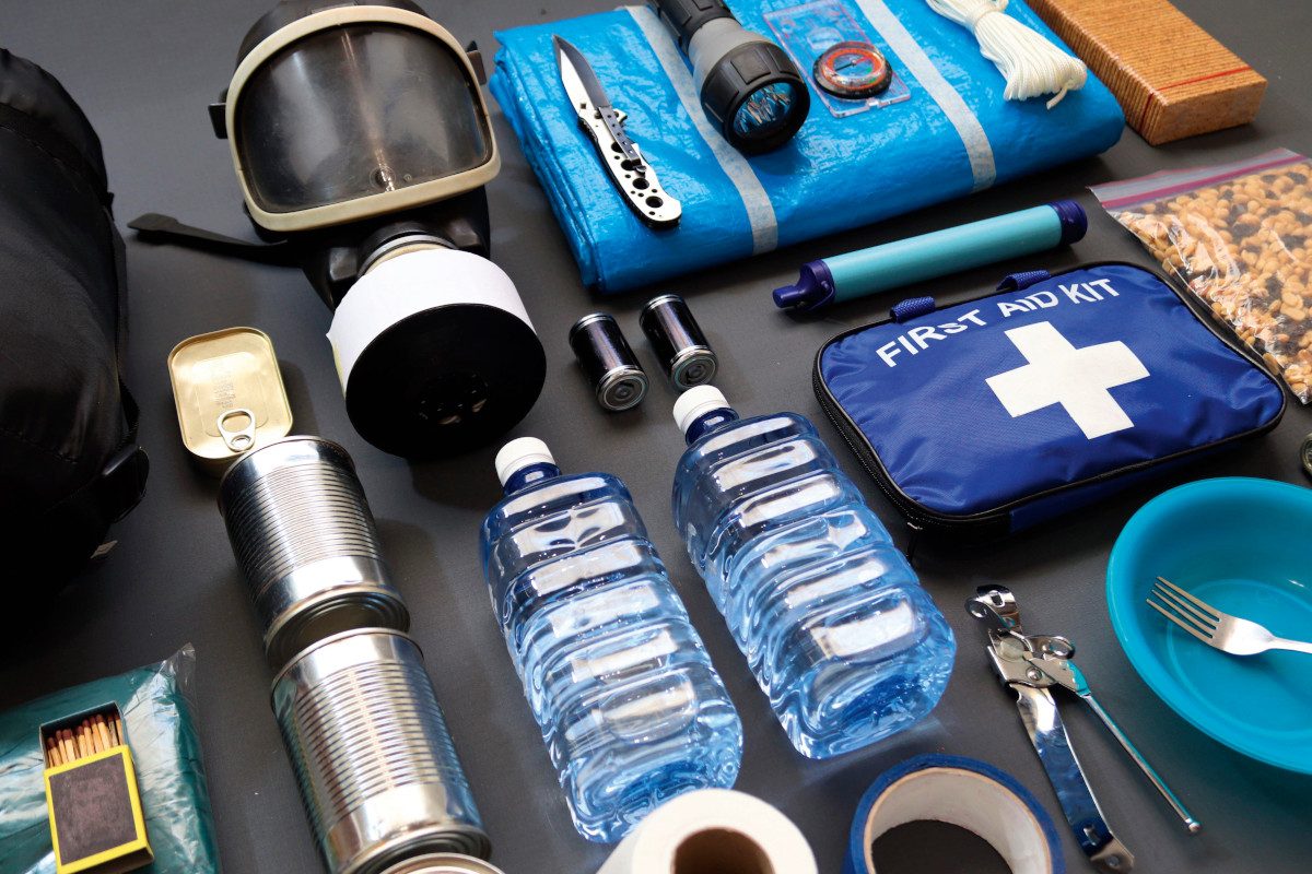 An assortment of survival equipment on a table