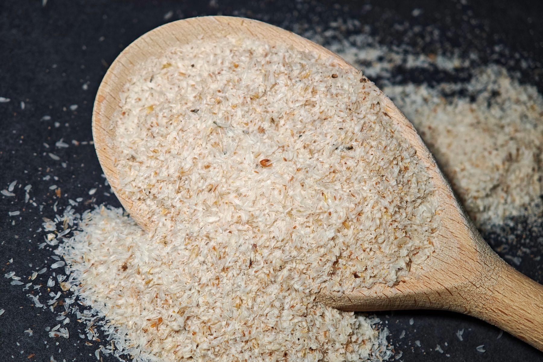Psyllium on a wooden spoon.