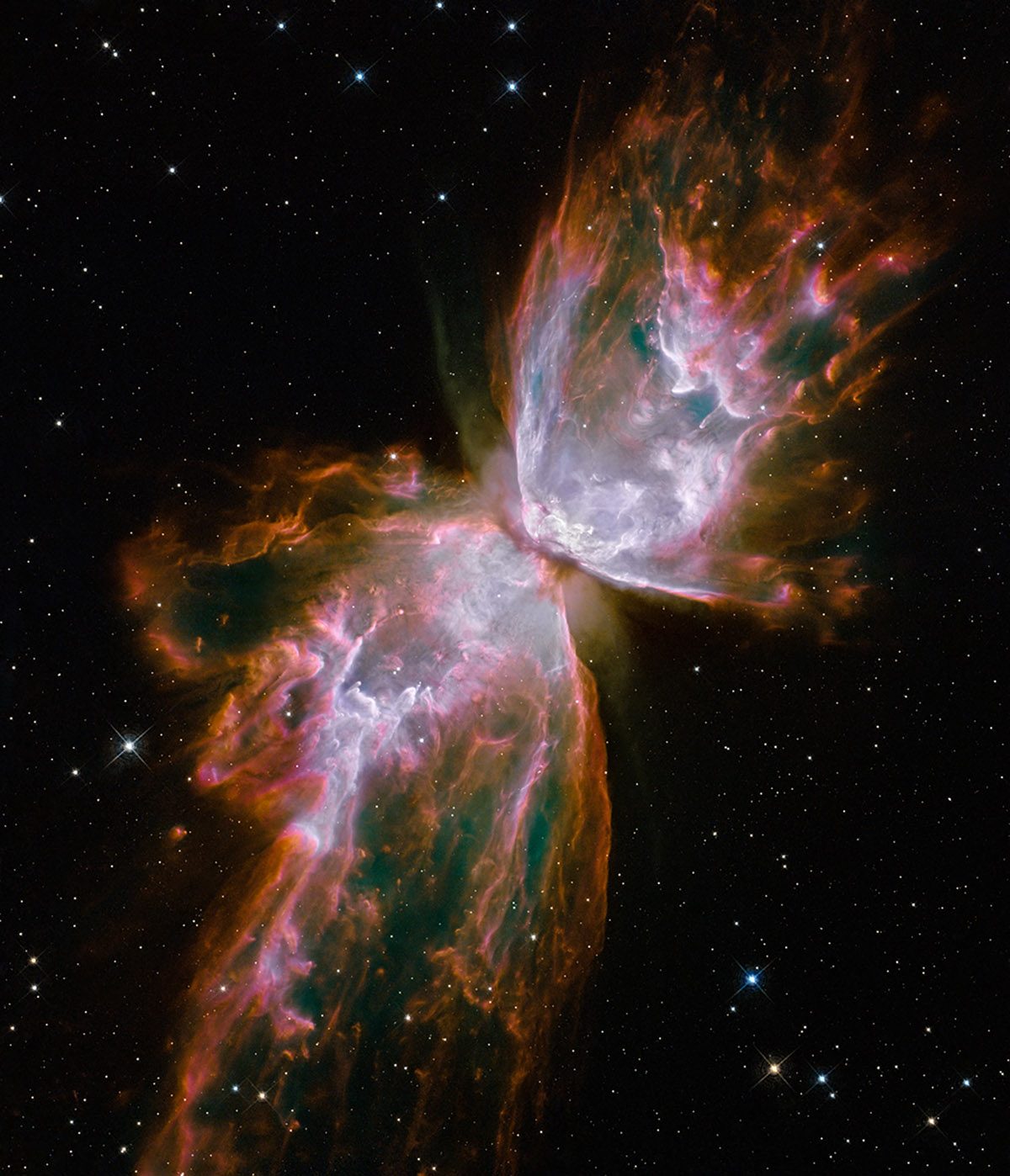 Hubble image of the Butterfly Nebula showing two large, wing‑like lobes of glowing gas and dust of a red and lilac hue, spreading out from a small dense centre into space, surrounded by small dotted stars.