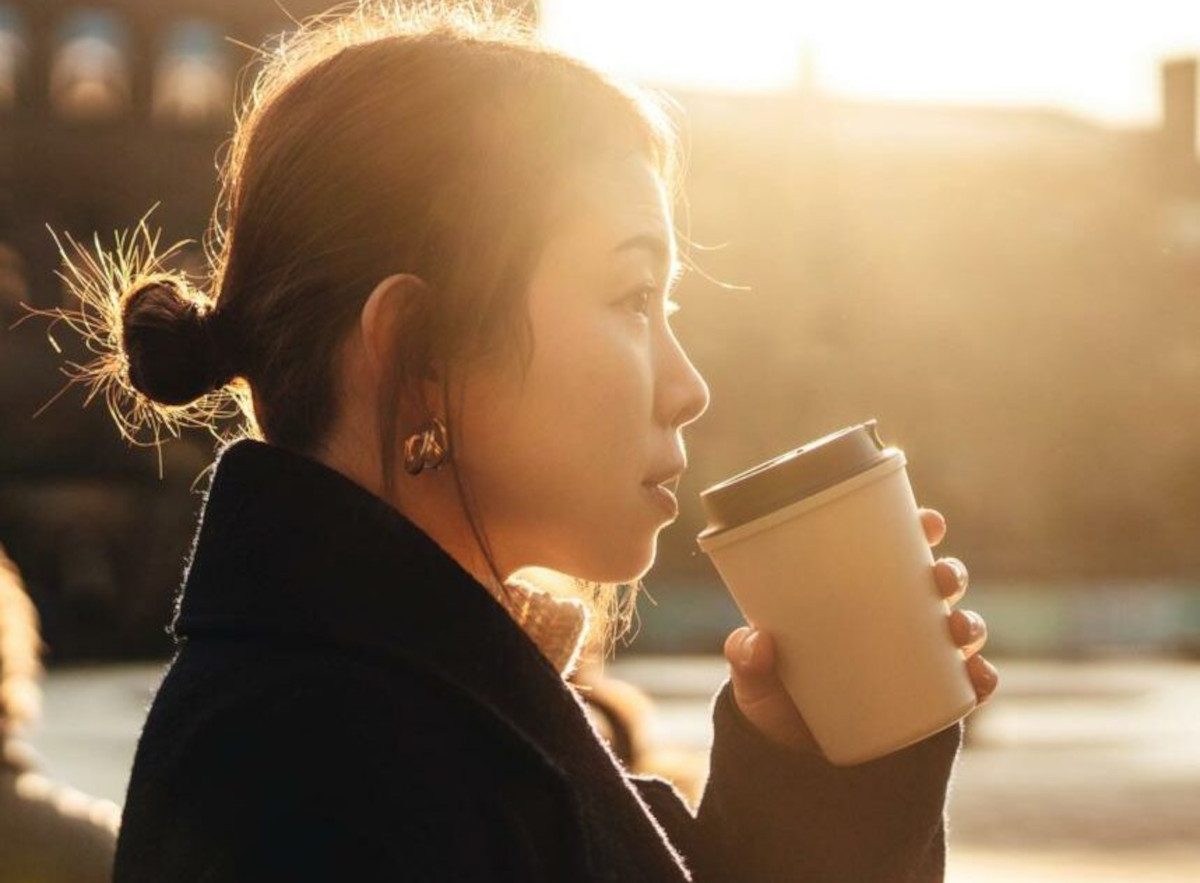Silhouette portrait of a person drinking coffee