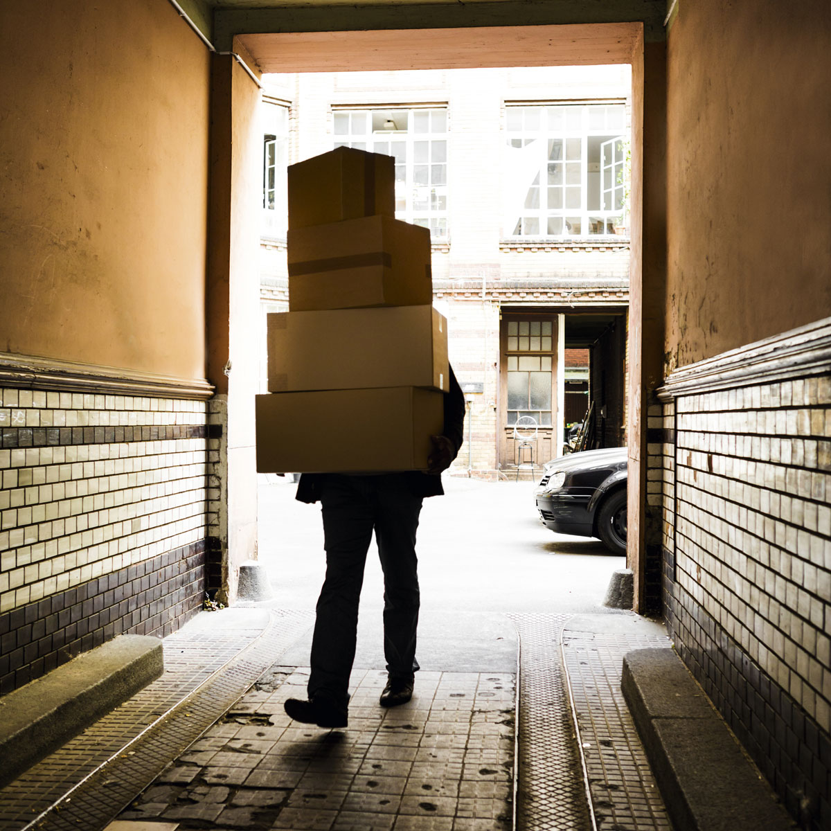A courier carrying packages.