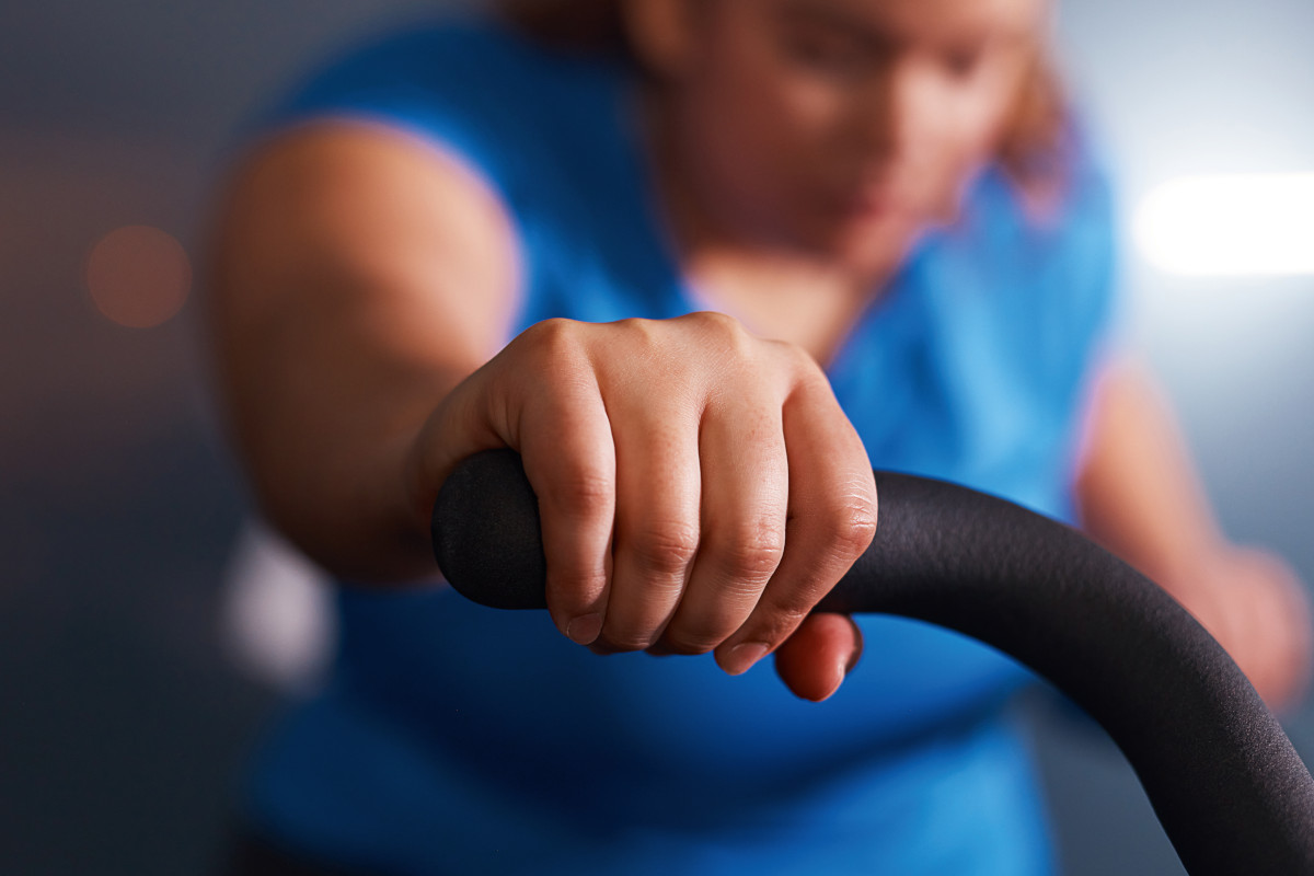 Photo of a person working out on an exercise bike.