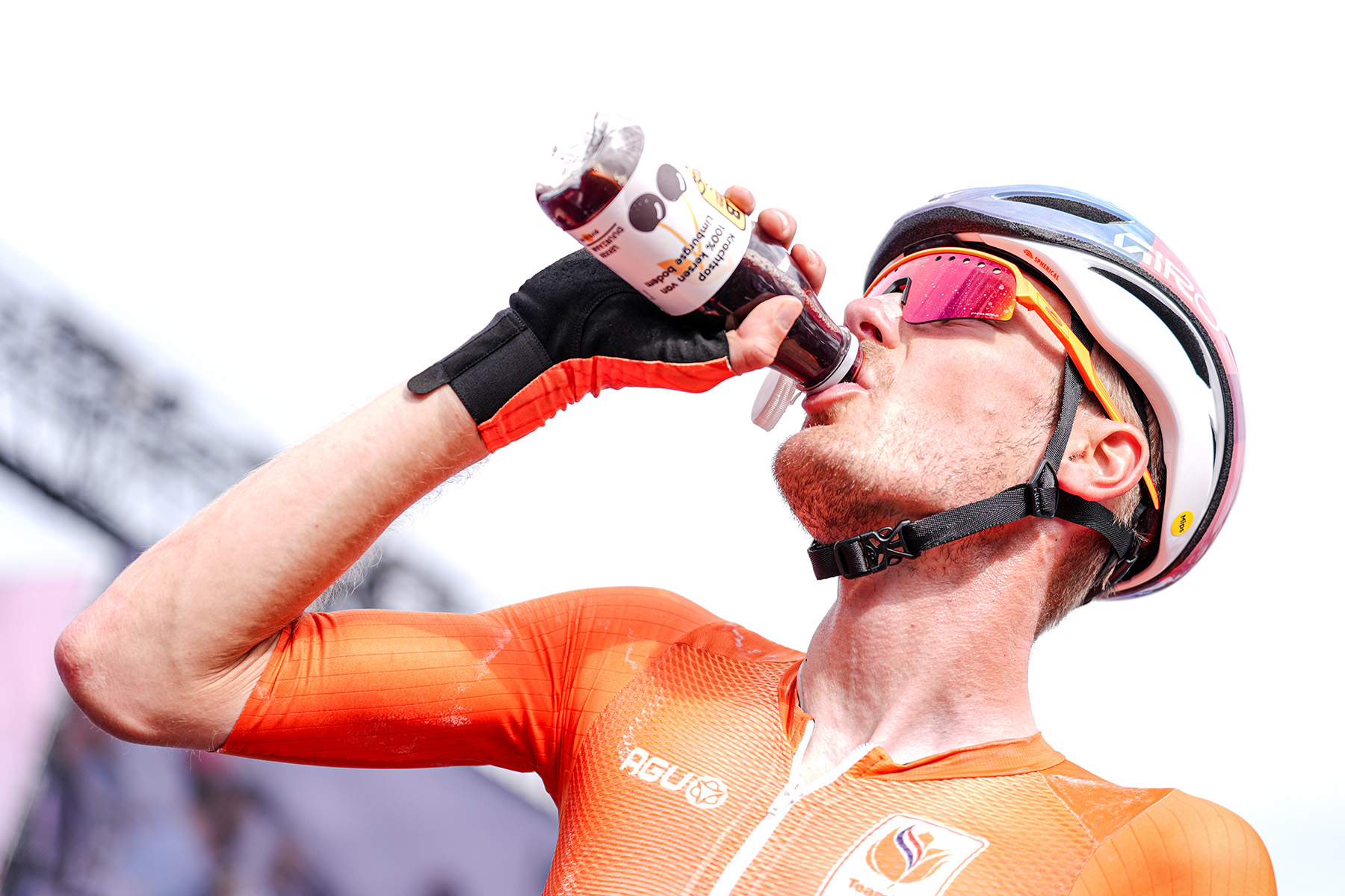 Cyclist drinking cherry drink