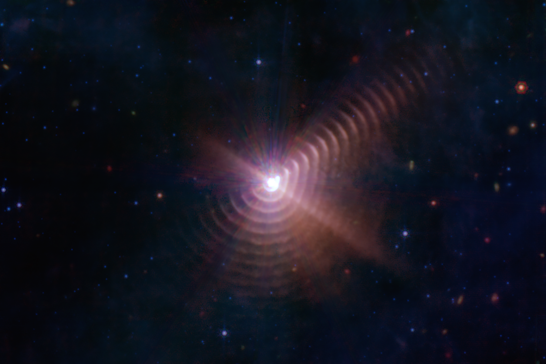 Star surrounded by rings of pinkish light
