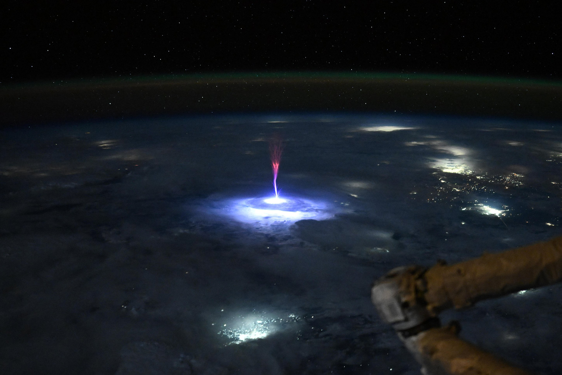 Lightning coming up from Earth, ending in a red tree