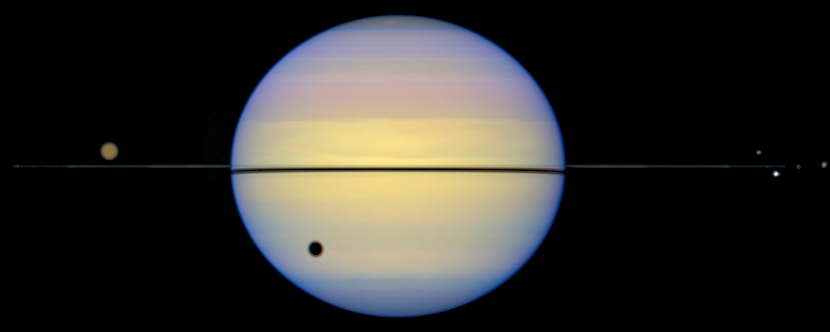 Saturn with no rings, but a shadow cast from them
