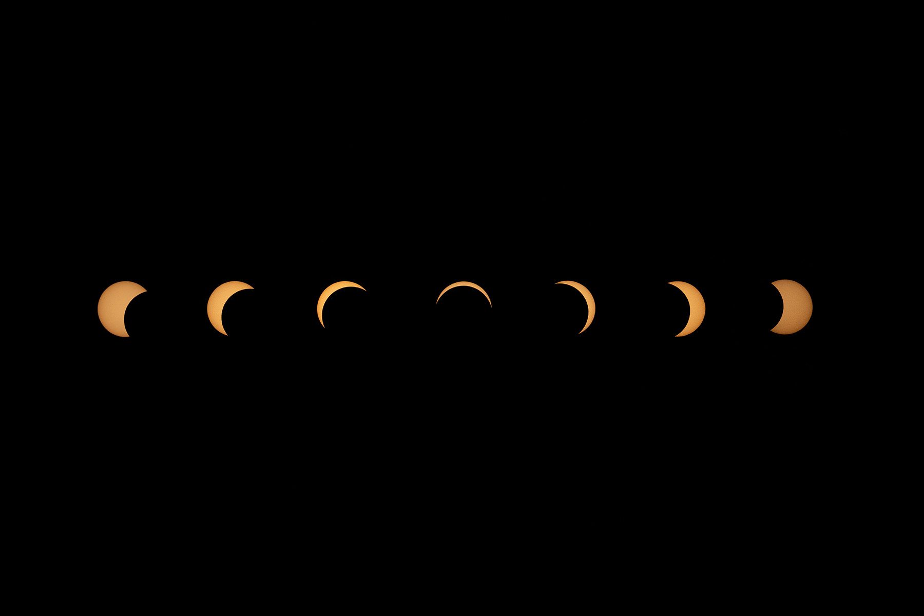 7 images showing the Sun getting progressively more covered and then reappearing again