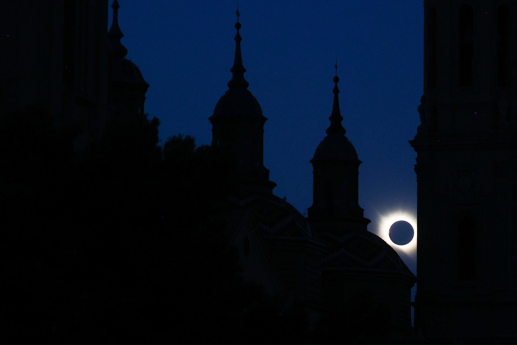 Eclipse through towers