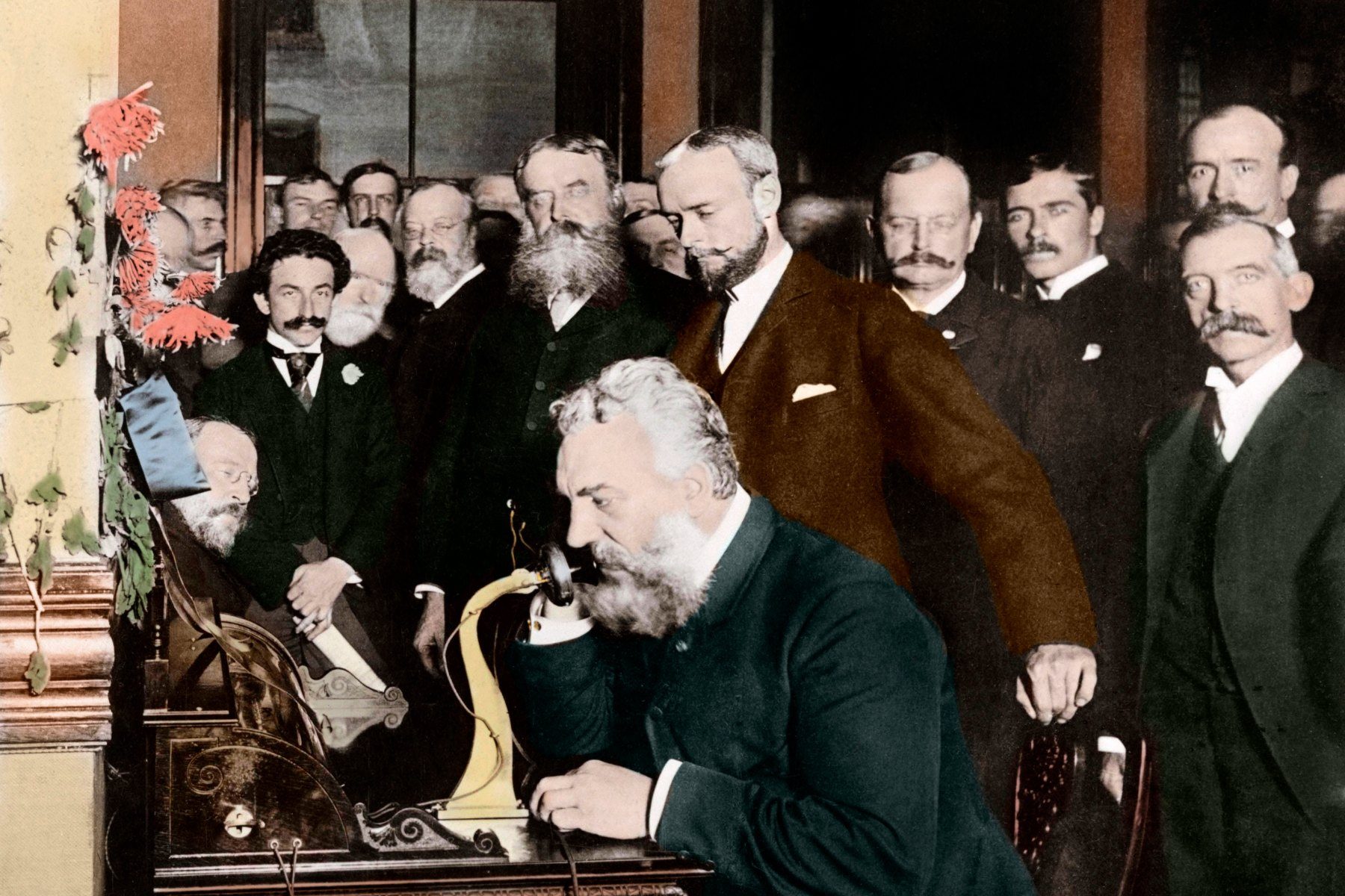 Bell speaking into an old telephone