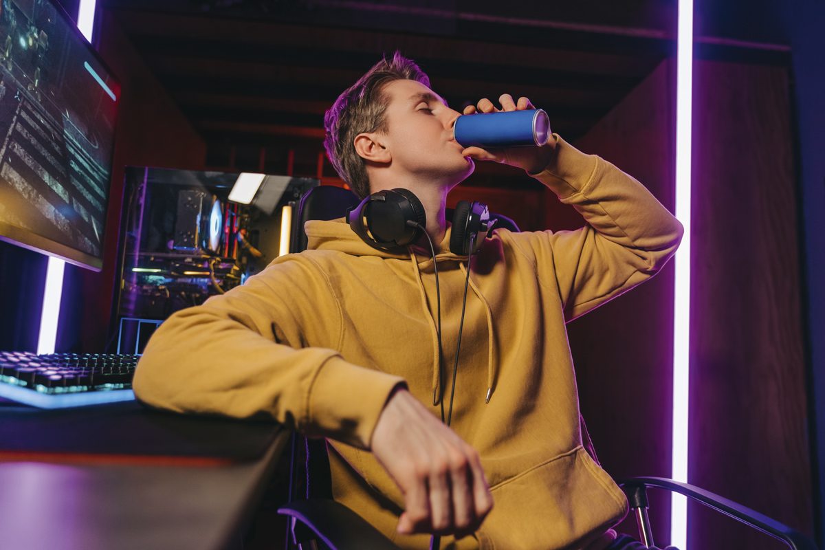 Teenager drinking an energy drink.