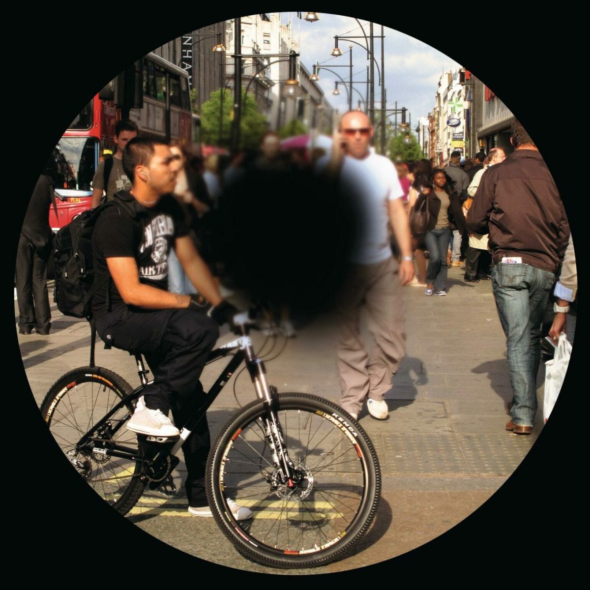Image depicting sight loss, with a big black spot in the middle of a crowd of people in a street