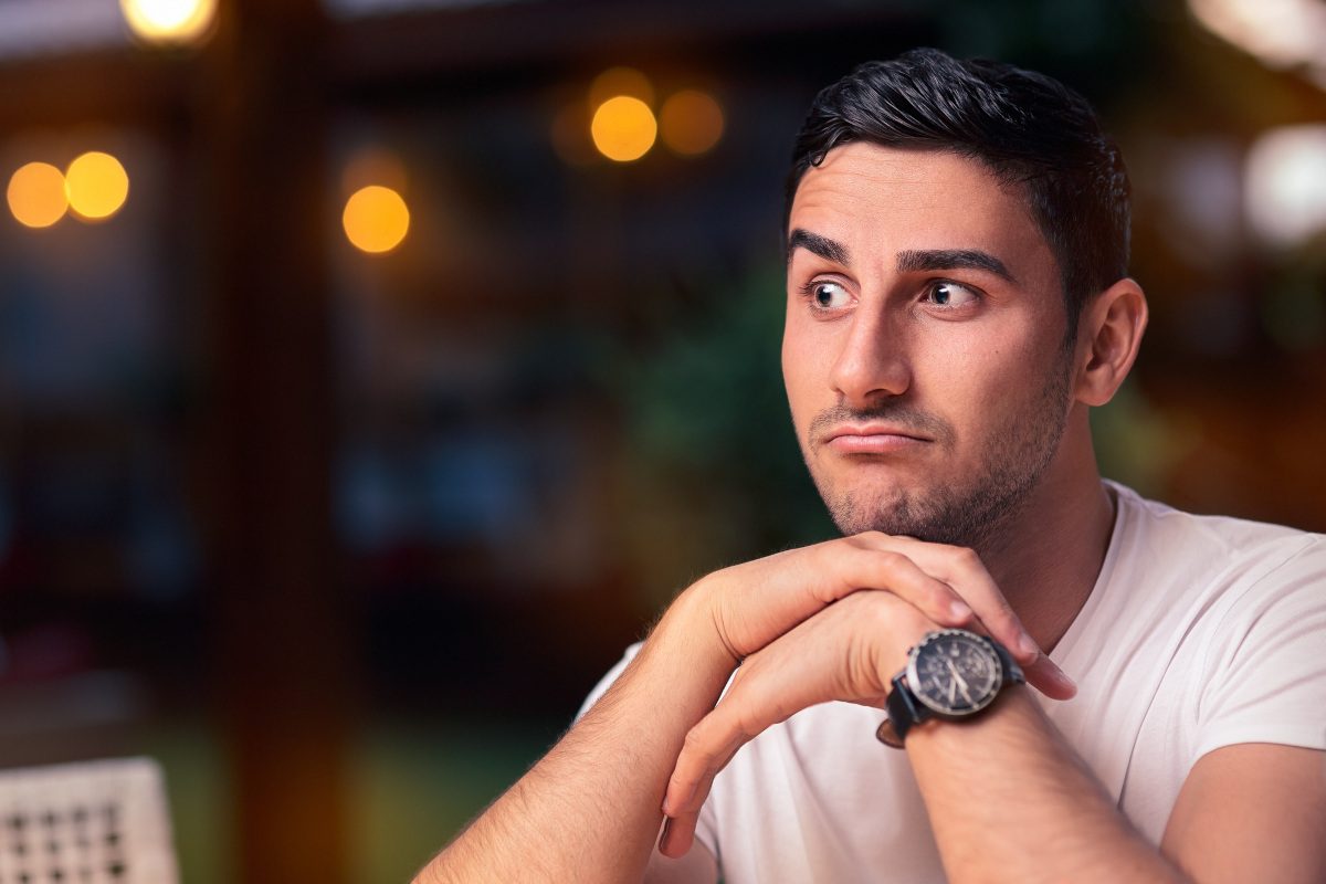 Funny expressive man waiting in a bar
