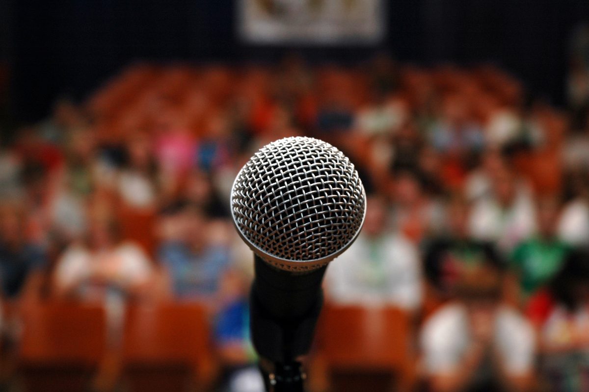 A mic is the only thing that stands between the audience and its prey.