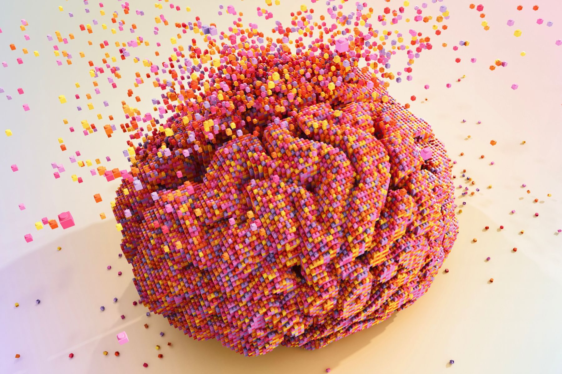 An abstract illustration of a brain made up of colourful blocks and disintegrating