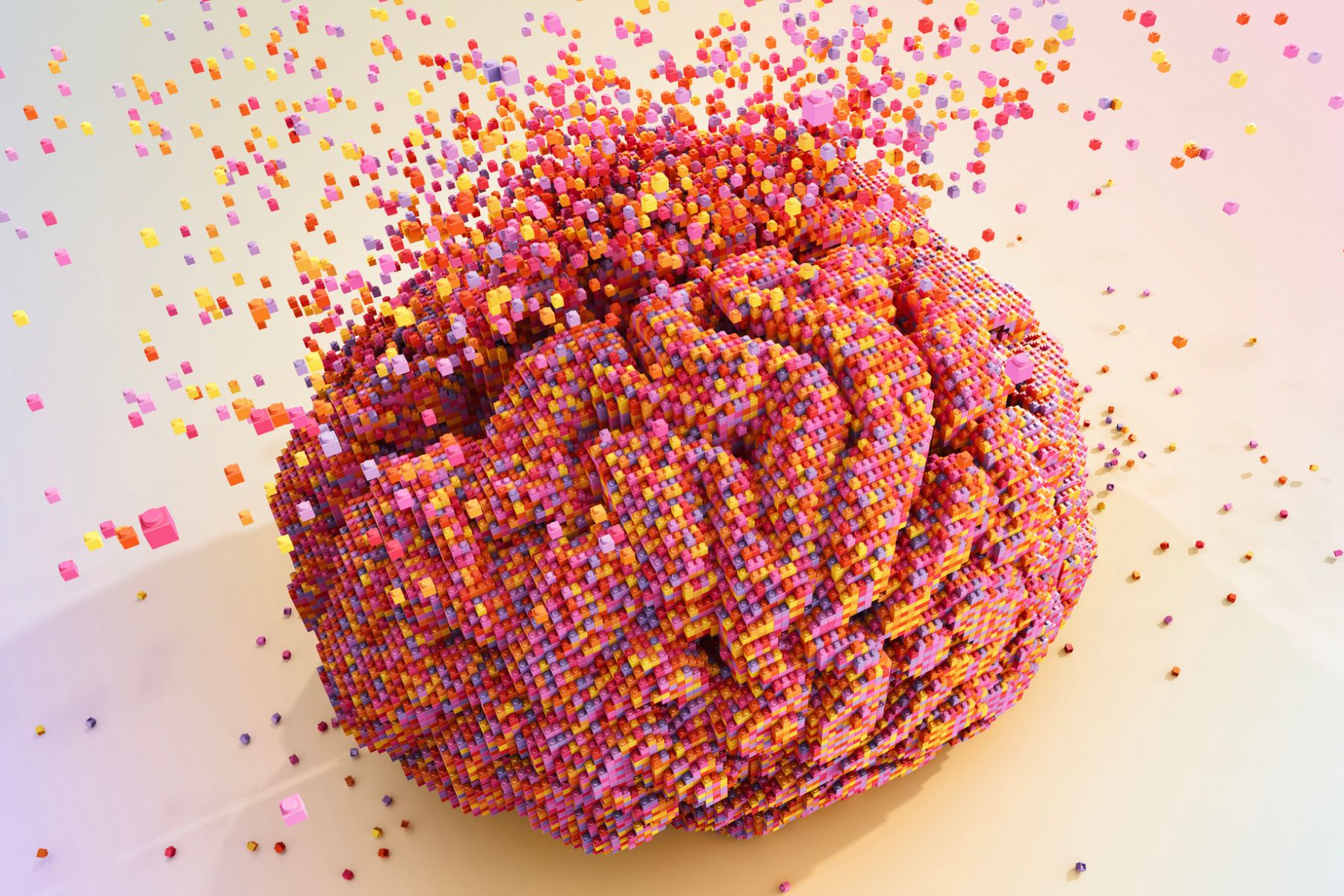 An abstract illustration of a brain made up of colourful blocks and disintegrating
