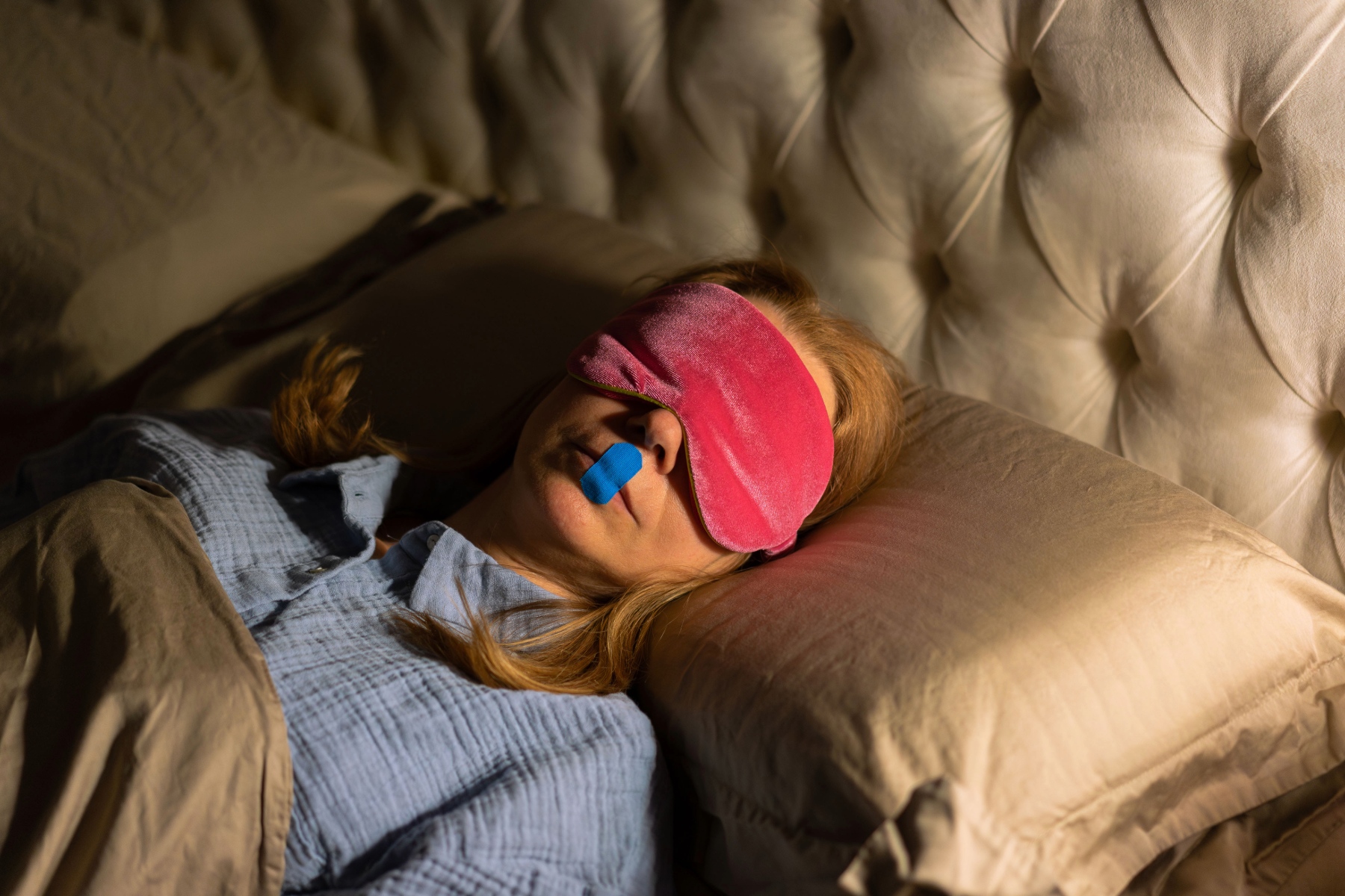 woman sleeping with mouth tape.