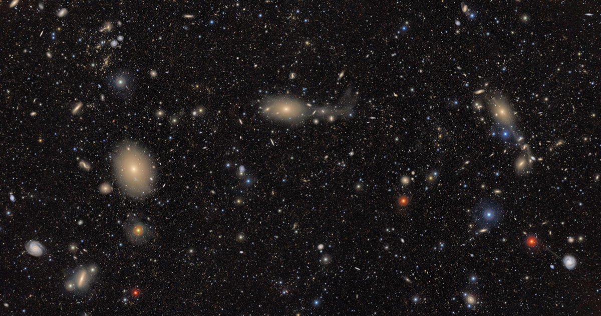 a expansive image showing a variety of different coloured galaxy and stars of varying sizes.