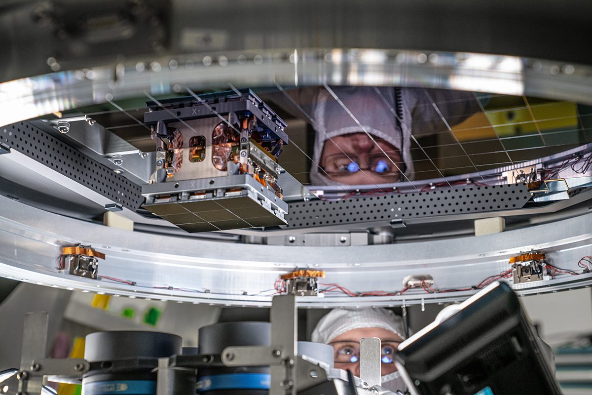 A Mechanical Engineer is looking at a circle of sensors for the vera rubin telescope.