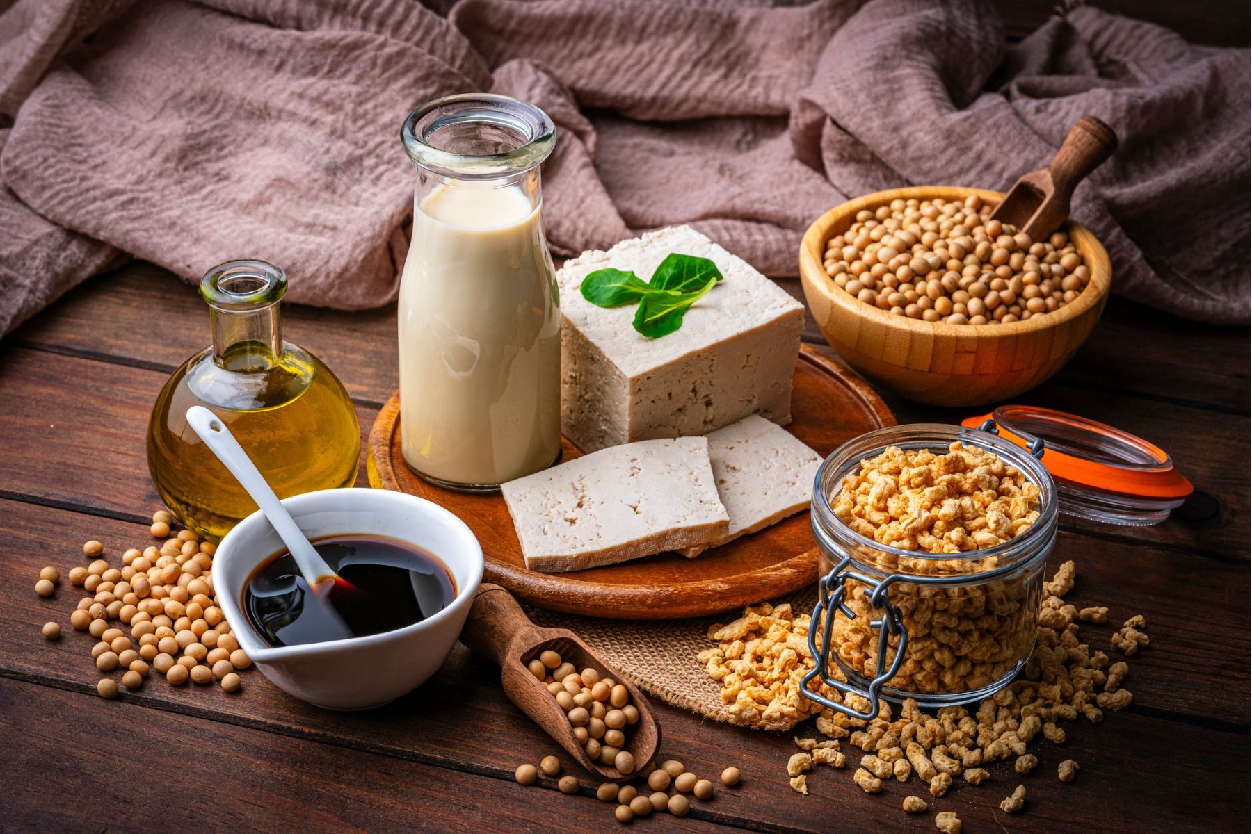 A selection of soy-based foods, including soybeans, soy milk, soy protein and tofu