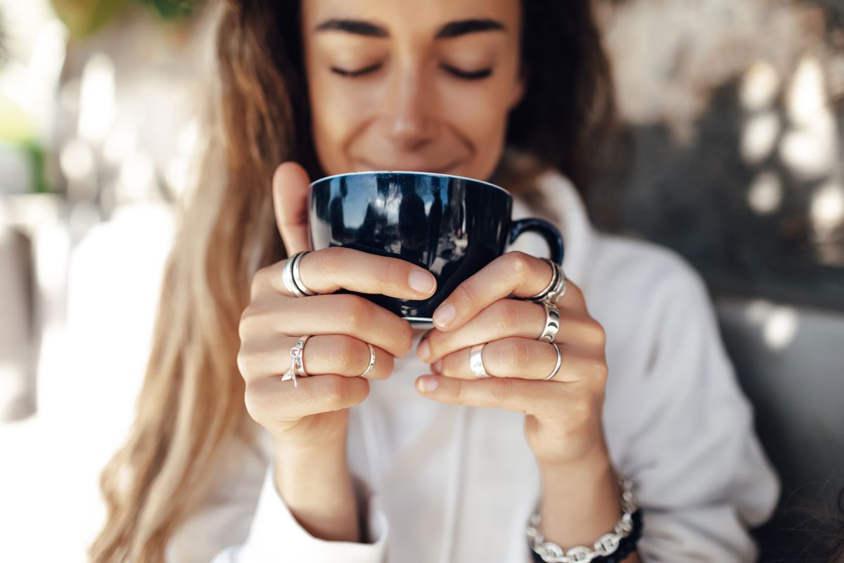 Woman holding mug