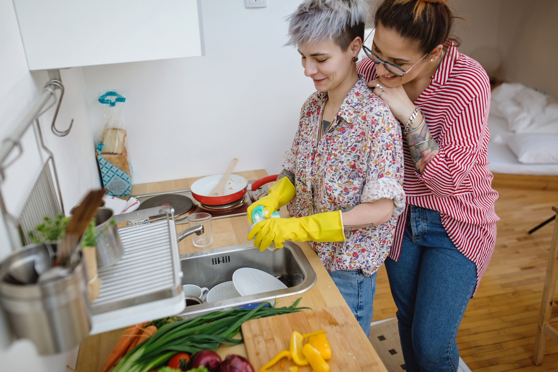 Couple washing dishes