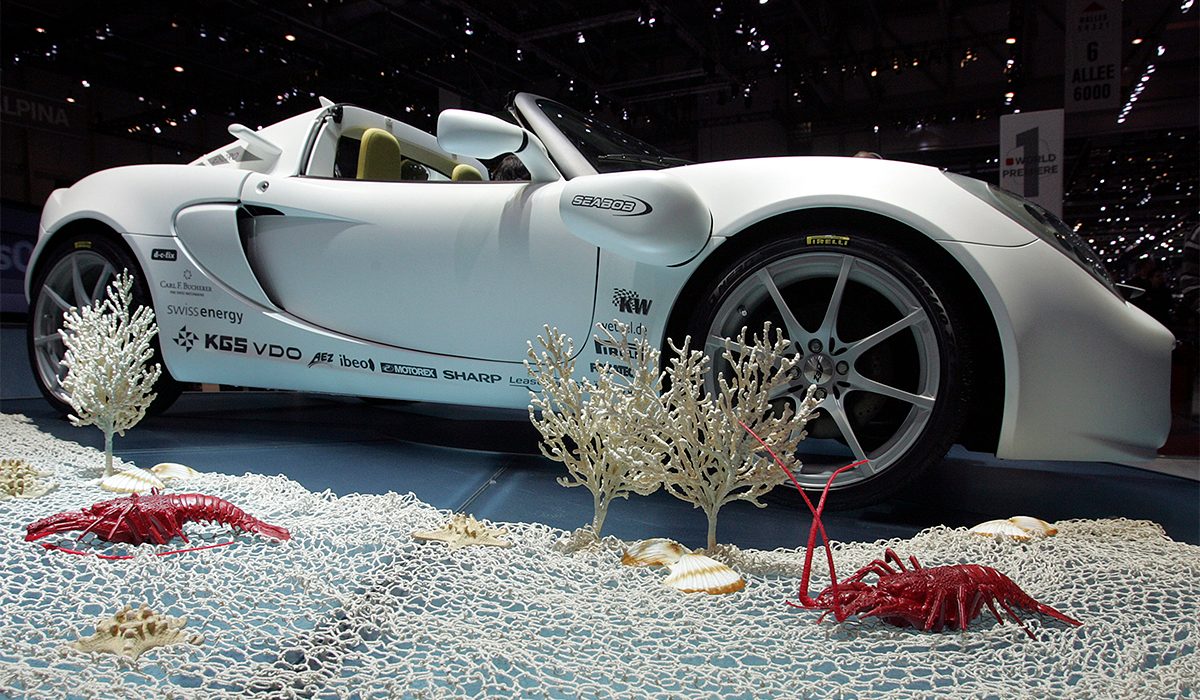 White car on fake sea floor.