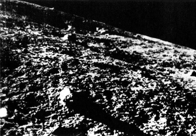 A grainy picture of the lunar surface.