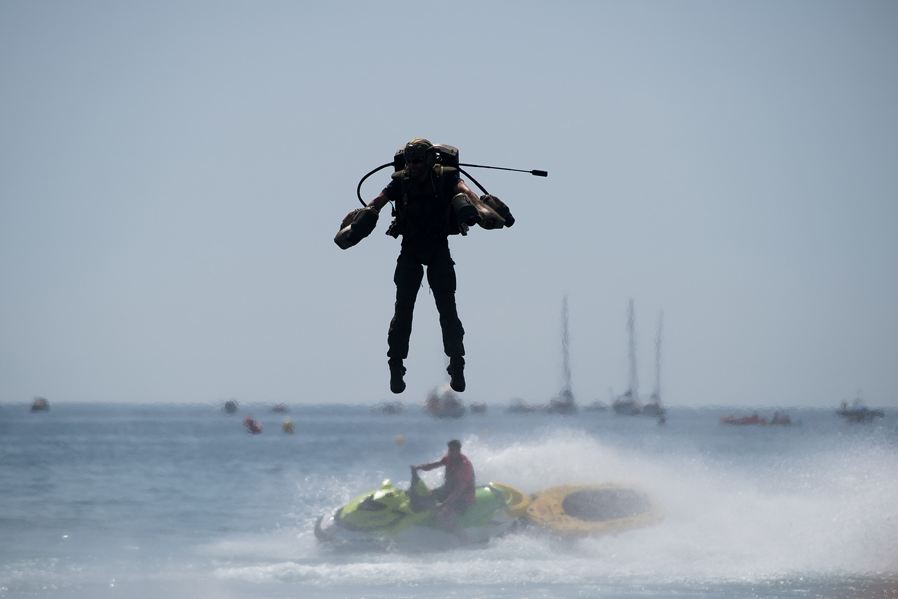 Jet suit jumping over water