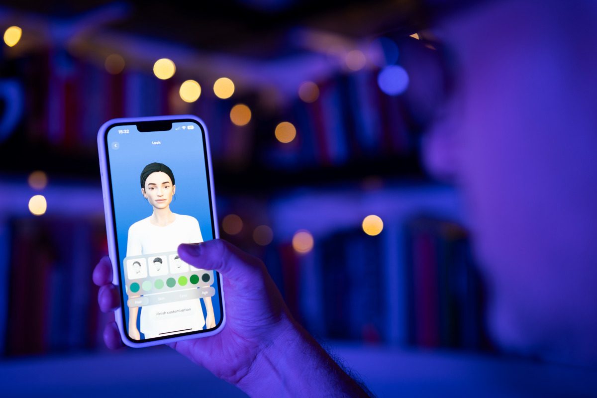 This illustration photo shows a user interacting with a smartphone app to customize an avatar for a personal artificial intelligence chatbot, known as a Replika