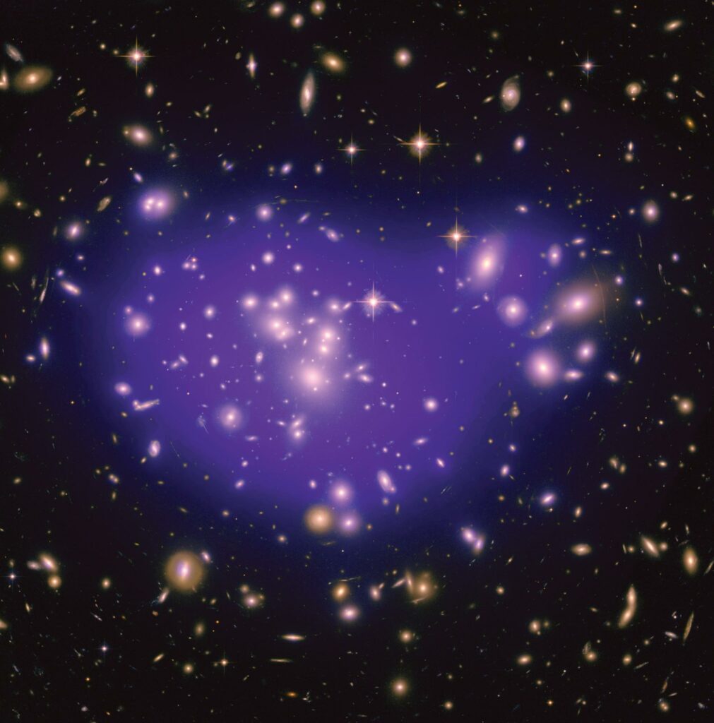 This image shows the galaxy cluster Abell 1689, with the mass distribution of the dark matter in the gravitational lens overlaid (in purple)
