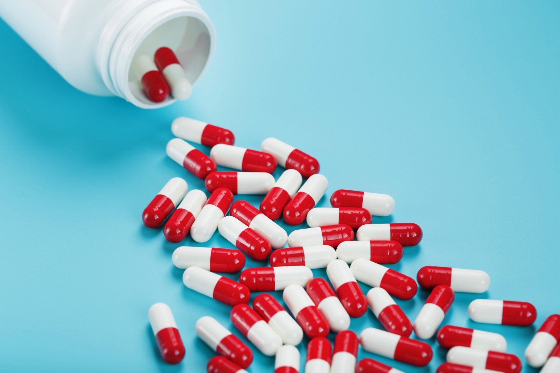 Pills spilling out of a bottle