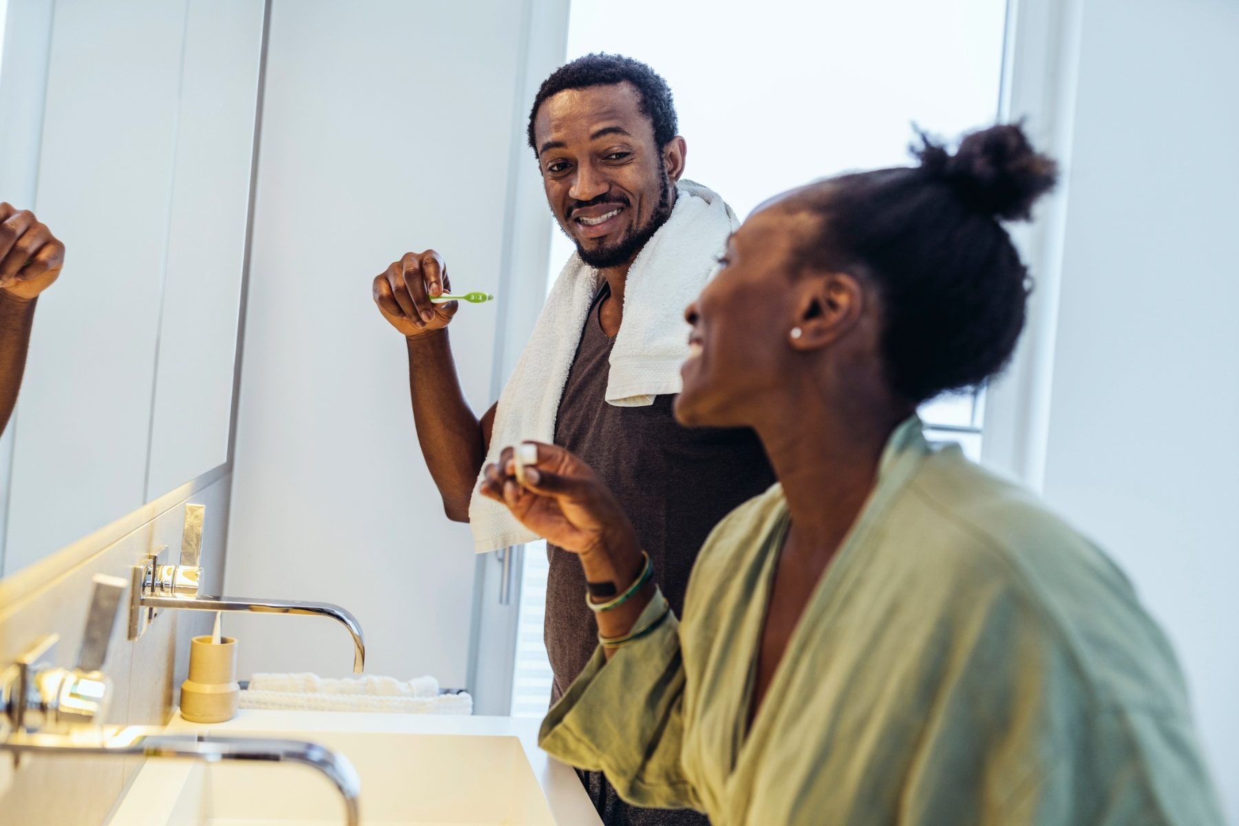 Couple brushing teeth together