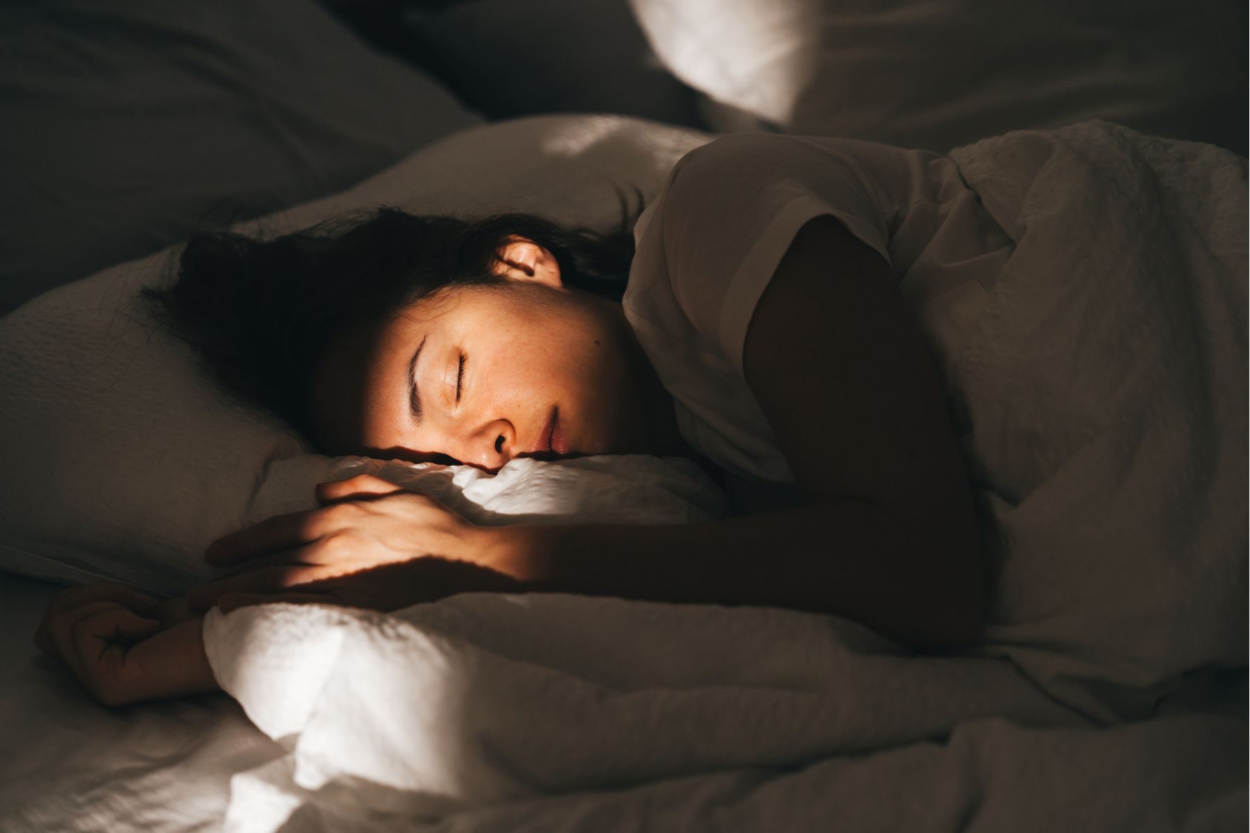 A woman asleep in bed