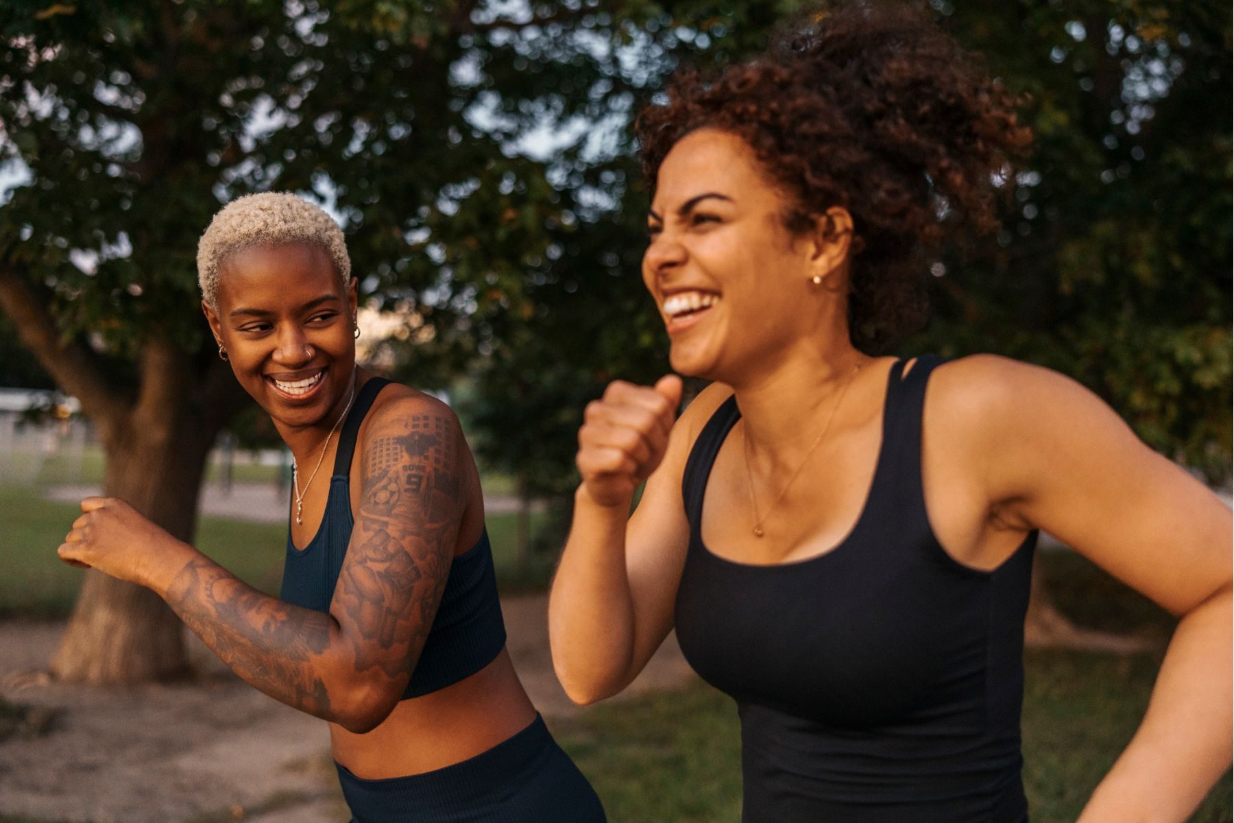 Two women run outside
