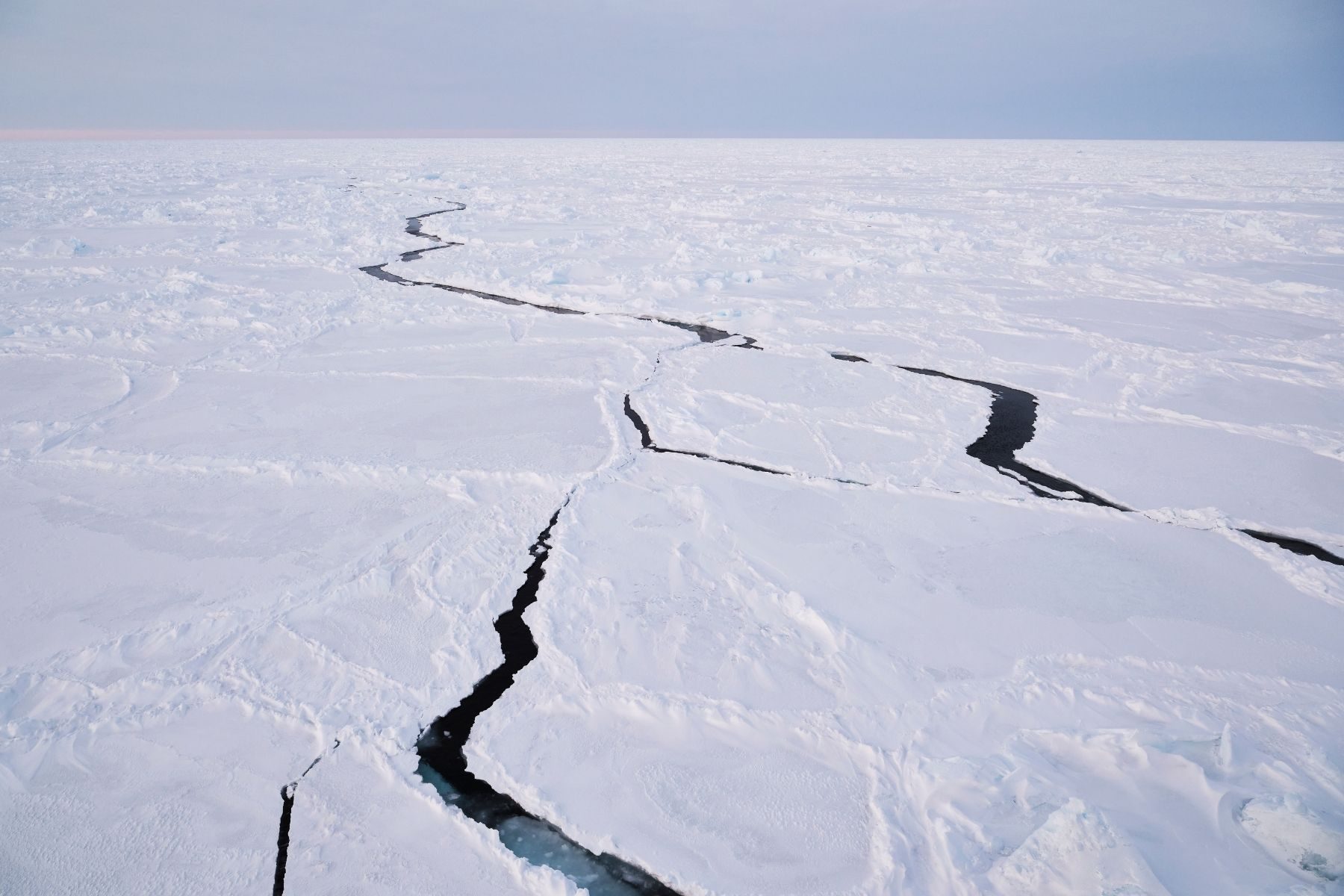Cracks in a flat icy landscape