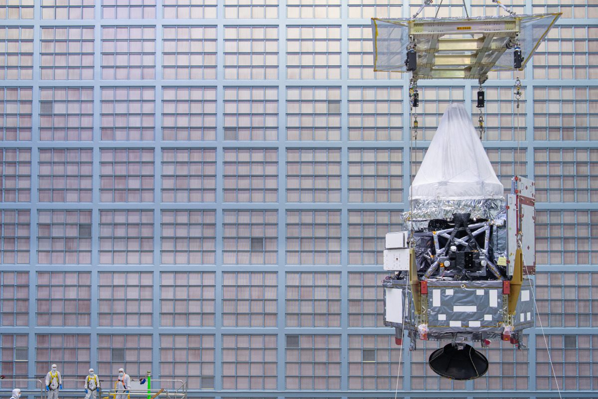 Photo of the Nancy Grace Roman Space Telescope, people on the left show the scale of the 'scope