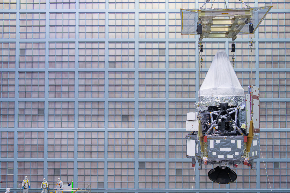 Photo of the Nancy Grace Roman Space Telescope, people on the left show the scale of the 'scope