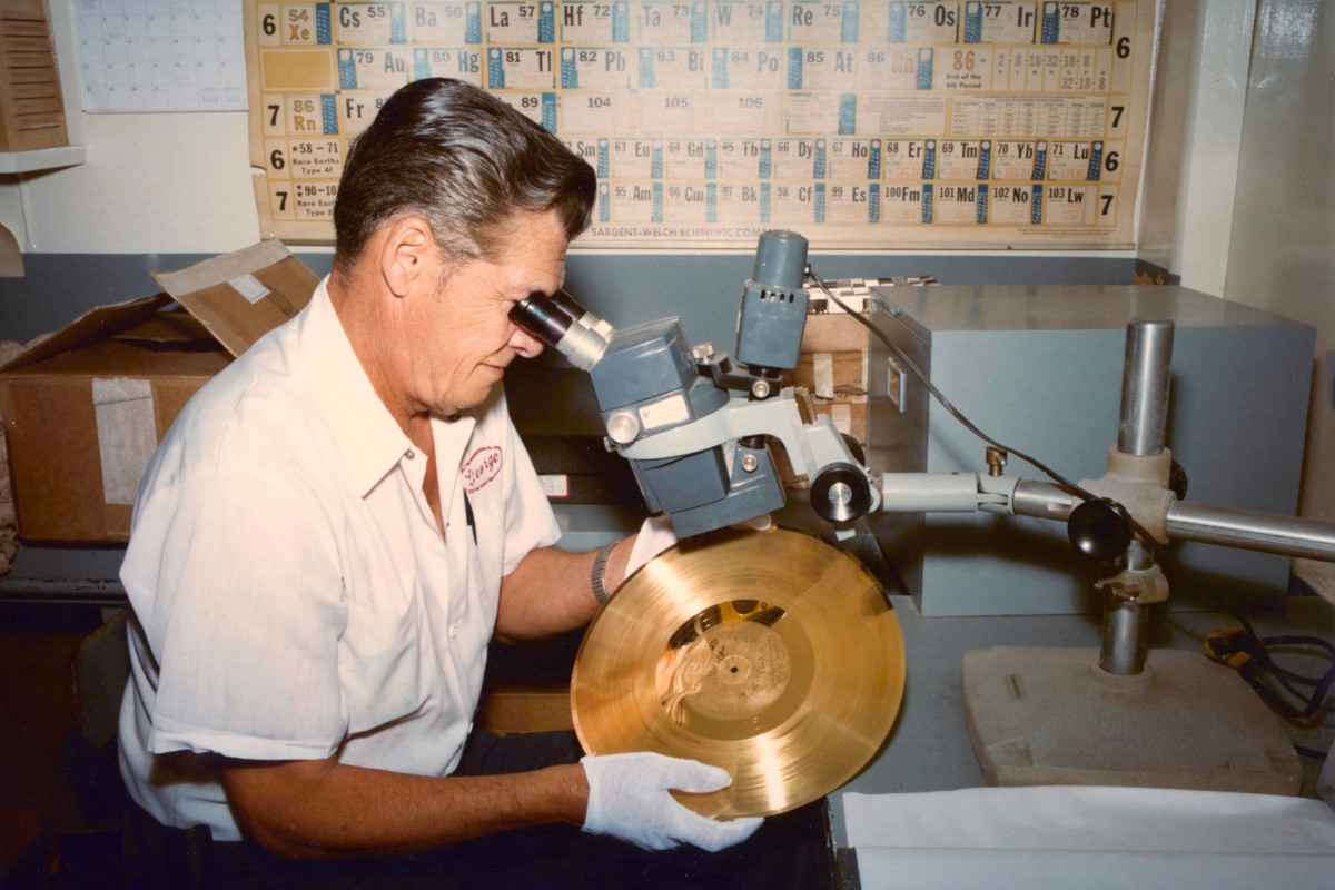 Photo of an engineer working on the Voyager Golden Record