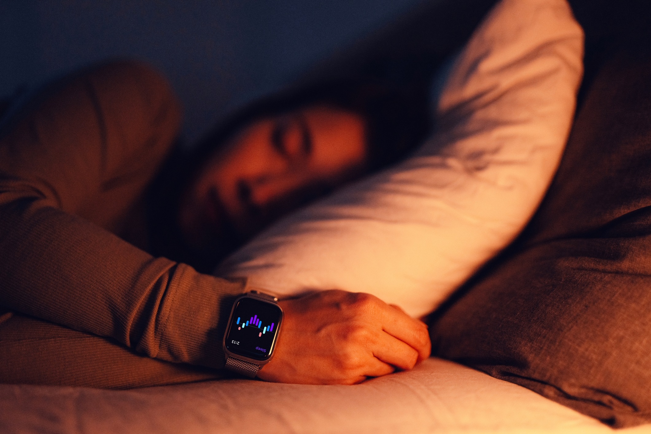 Man sleeping with smartwatch