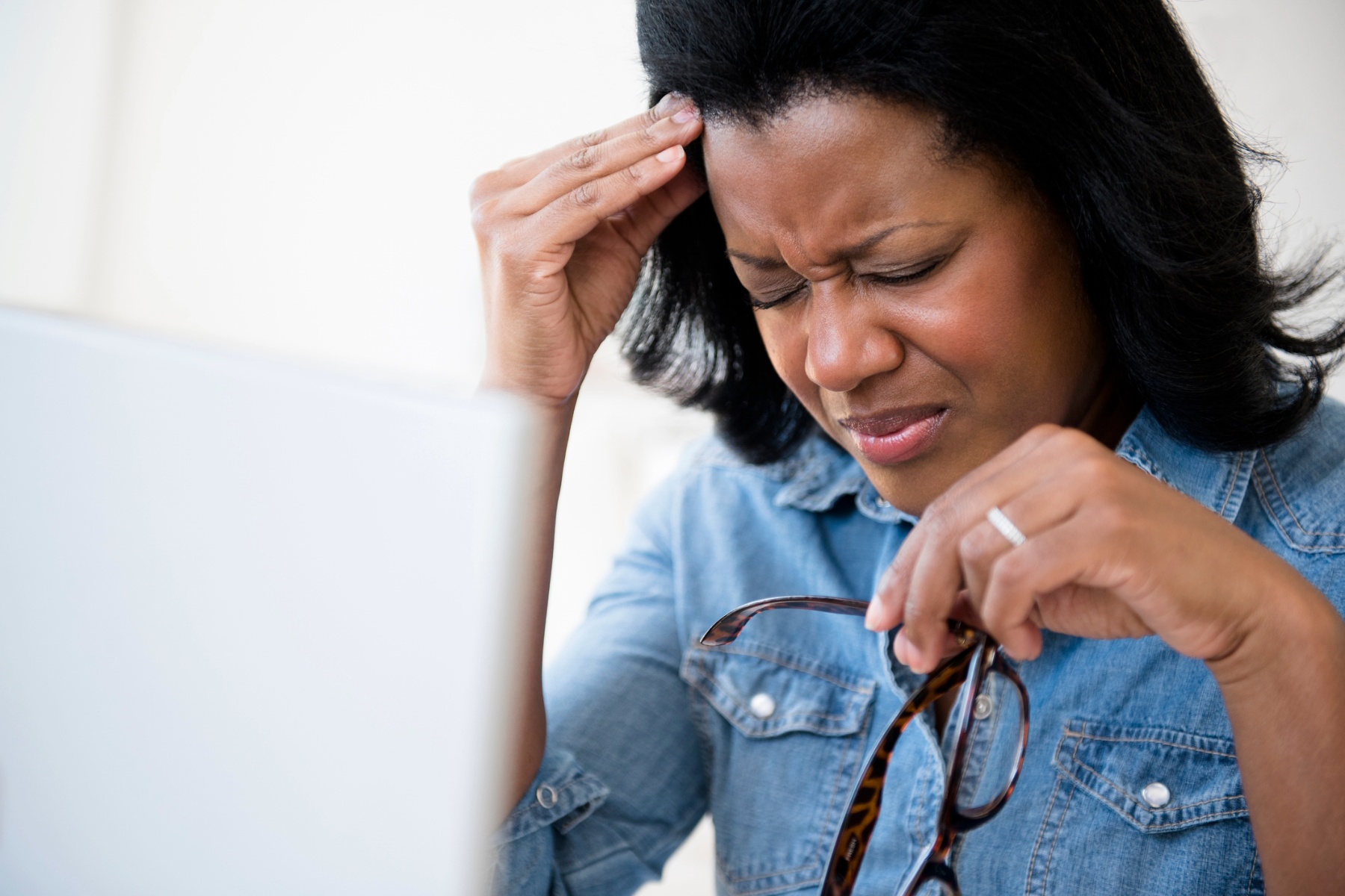 Woman at work having a headache