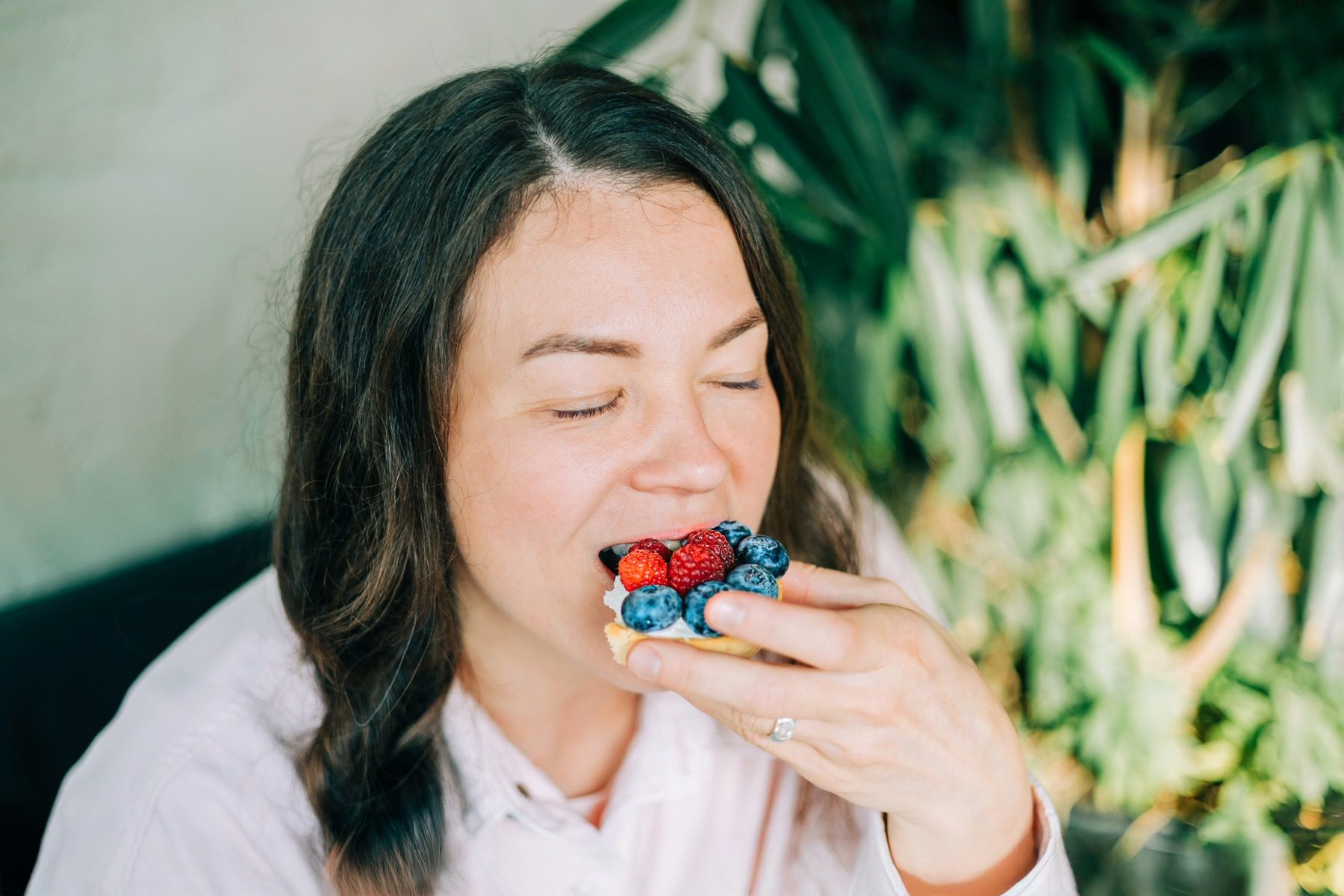 Woman enjoying eating some berries