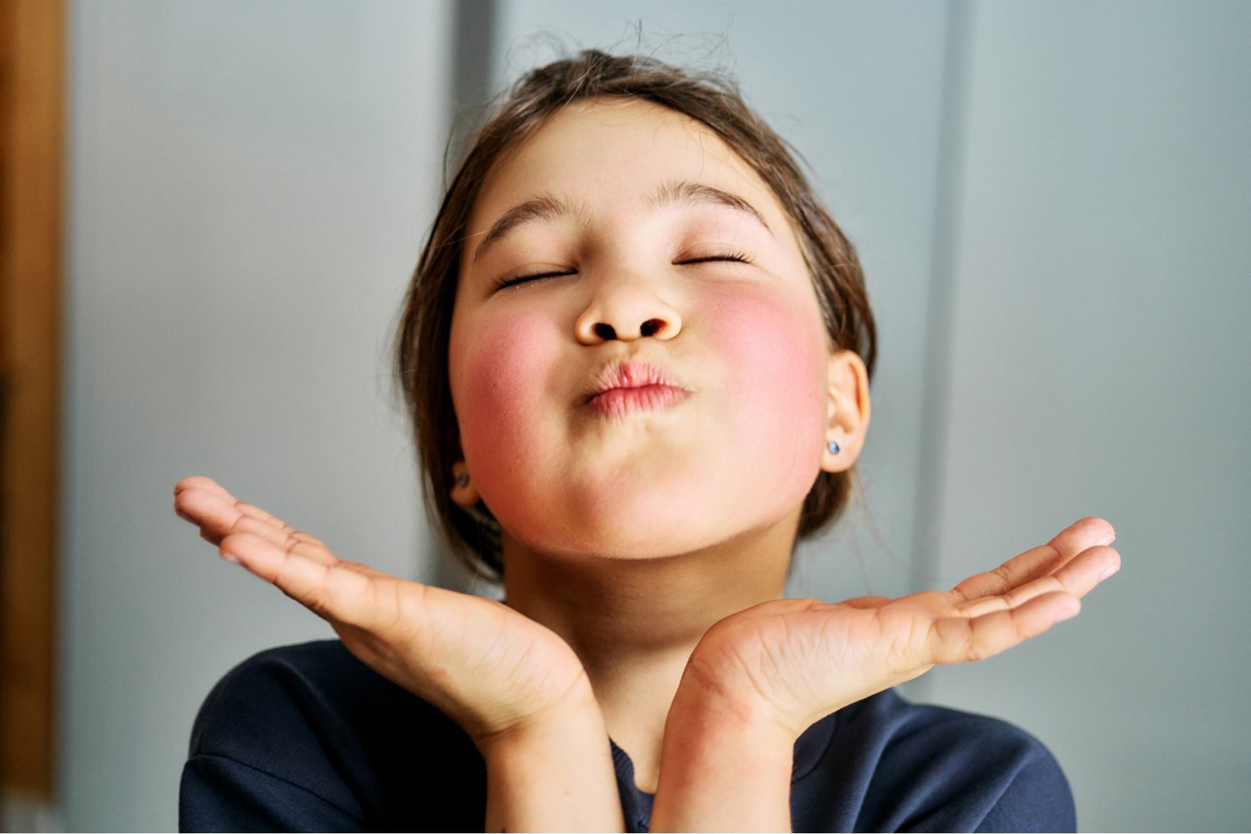 A little girl with red cheeks